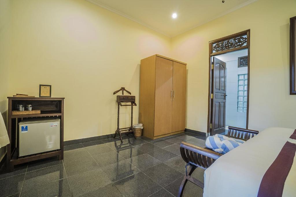 Postel nebo postele na pokoji v ubytování Nyoman Sandi Guest House
