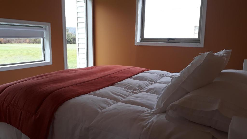Postel nebo postele na pokoji v ubytování Achibueno Lodge
