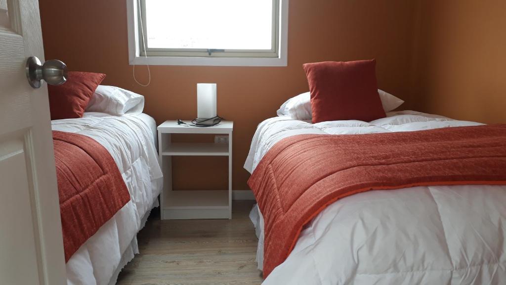 Postel nebo postele na pokoji v ubytování Achibueno Lodge