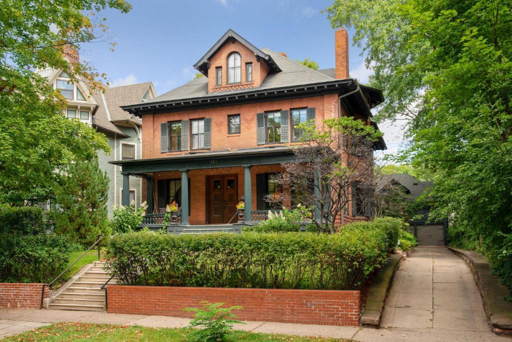 a brick house with a chimney on top of it at Historic District BnB in Saint Paul