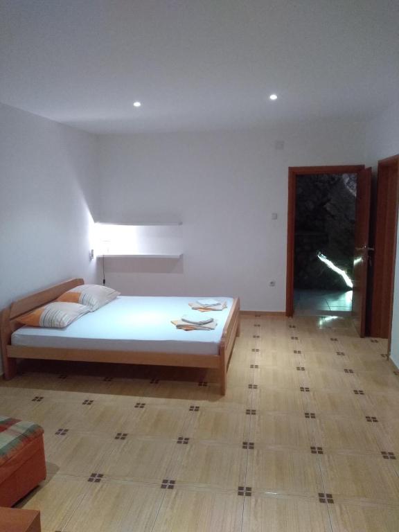Postel nebo postele na pokoji v ubytování Apartments Villa Čučuk