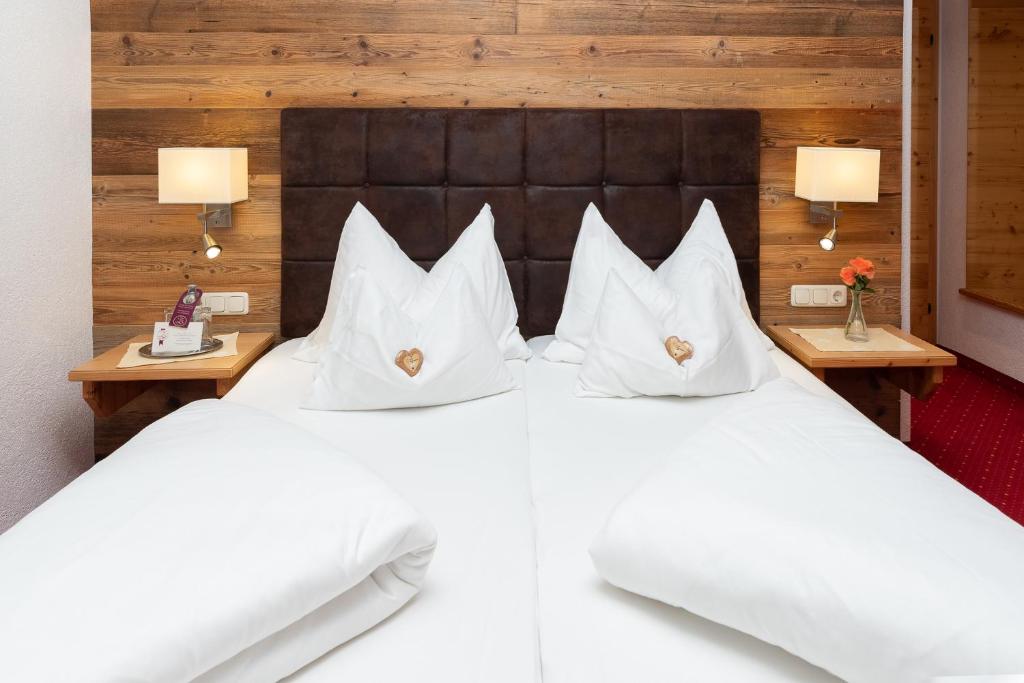 Postel nebo postele na pokoji v ubytování Hotel Zimmerbräu