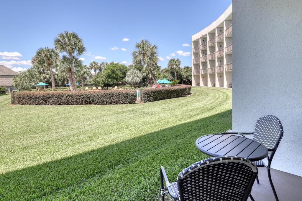 a chair sitting on the porch of a hotel at Pirates' Bay Marina II in Fort Walton Beach