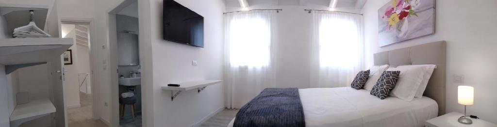 Postel nebo postele na pokoji v ubytování Le Mandragole B&B