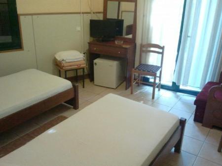 A bed or beds in a room at Diethnes