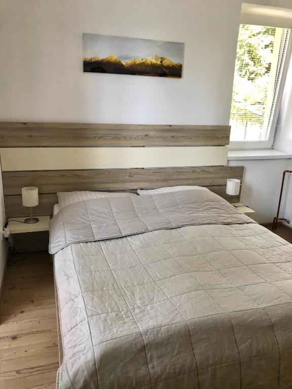 Postel nebo postele na pokoji v ubytování Vila Bellis