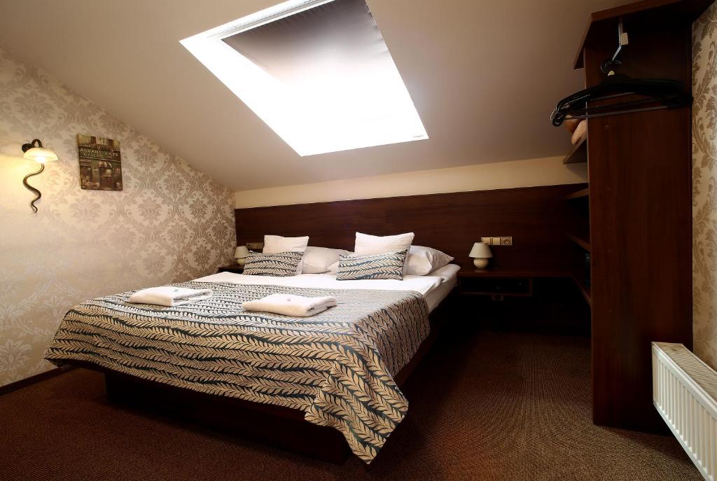 Postel nebo postele na pokoji v ubytování Hotel Roudna
