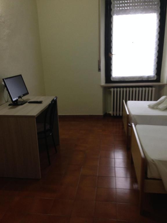 Postel nebo postele na pokoji v ubytování Albergo San Michele
