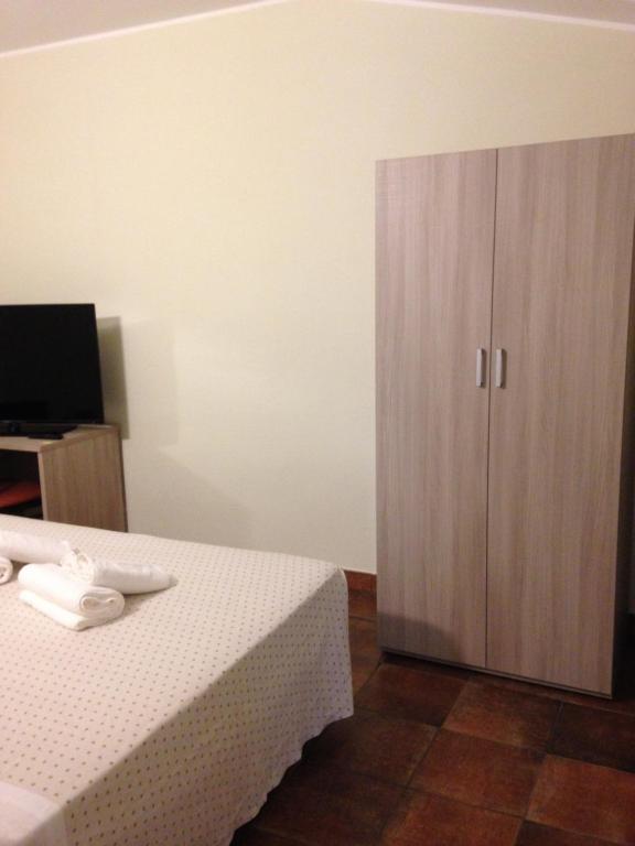 Postel nebo postele na pokoji v ubytování Albergo San Michele