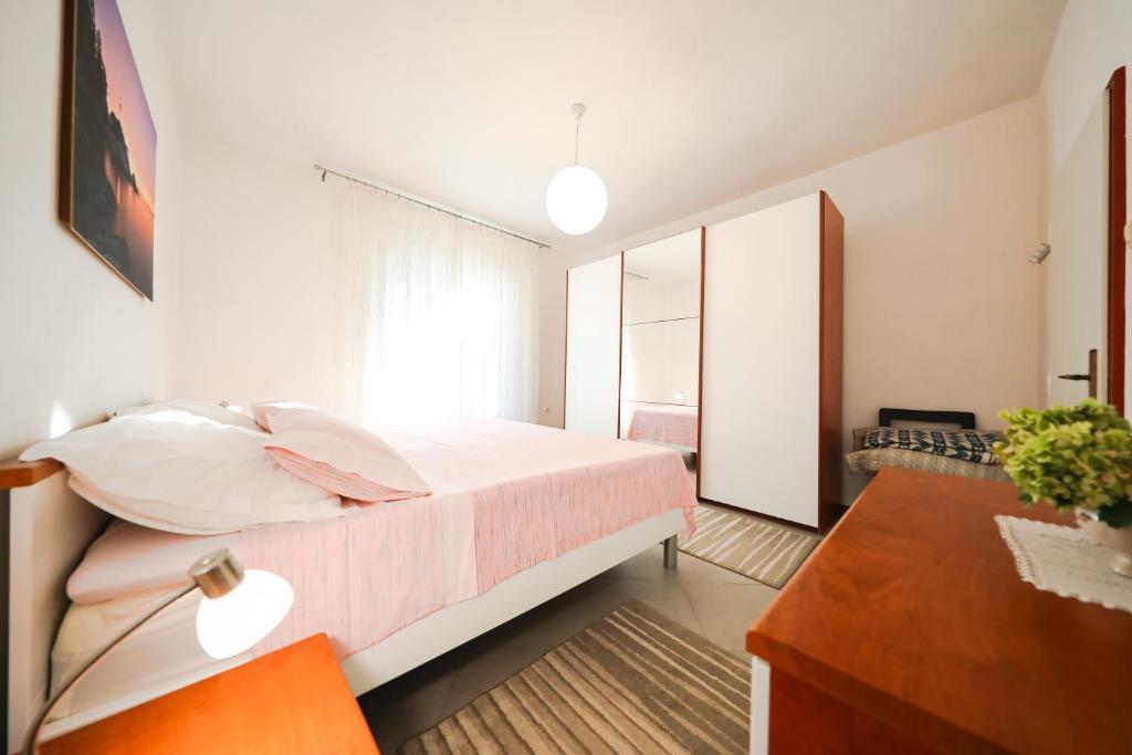 Posteľ alebo postele v izbe v ubytovaní Apartman Antisin