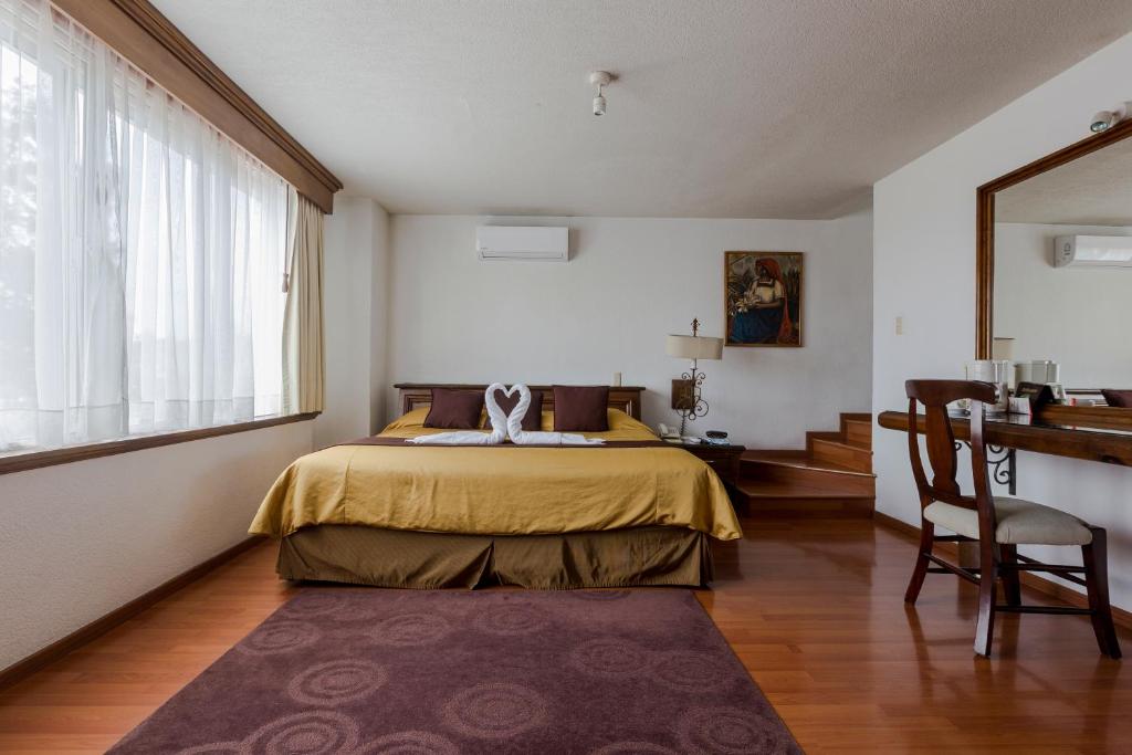 Postel nebo postele na pokoji v ubytování Casa de la Loma