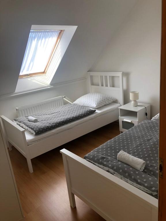 A bed or beds in a room at Tihany Levendula Villa