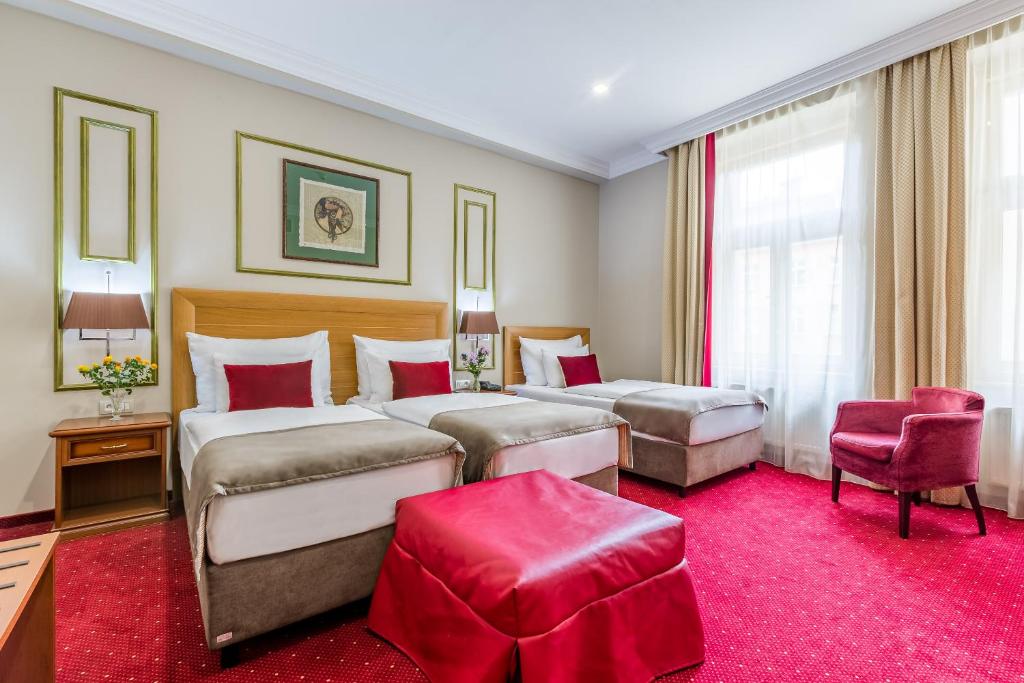 Postel nebo postele na pokoji v ubytování Hotel Caruso Old Town