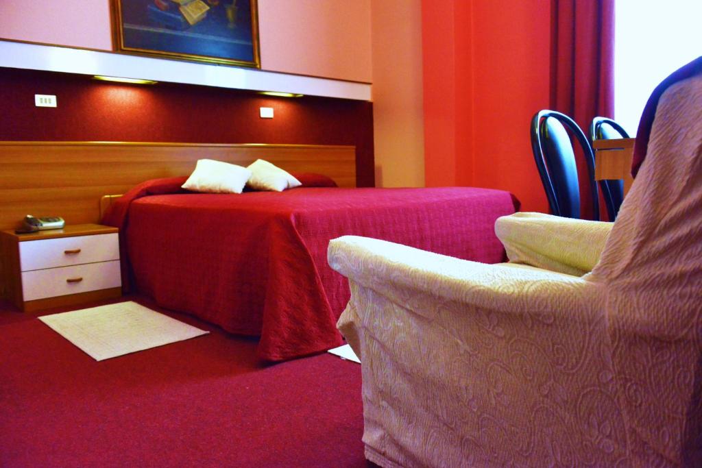 Postel nebo postele na pokoji v ubytování Hotel Rosy
