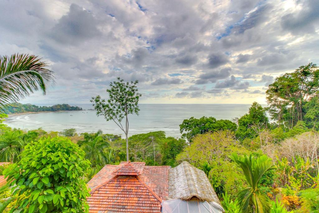 a house with a view of the ocean at Canto del Mar #20 in Dominical