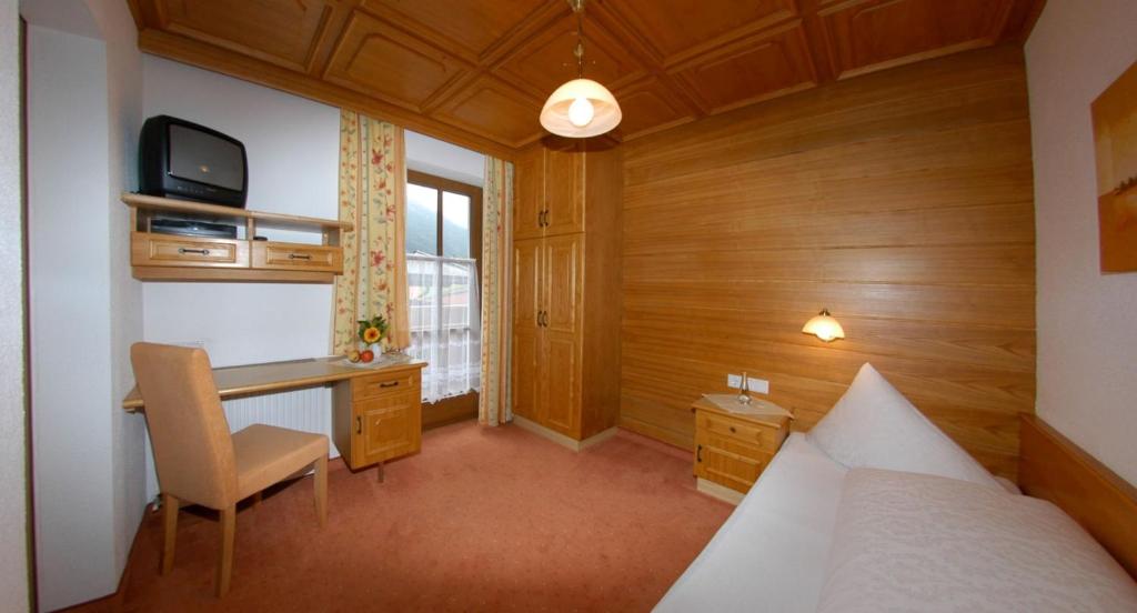 Postel nebo postele na pokoji v ubytování Haus Romantika