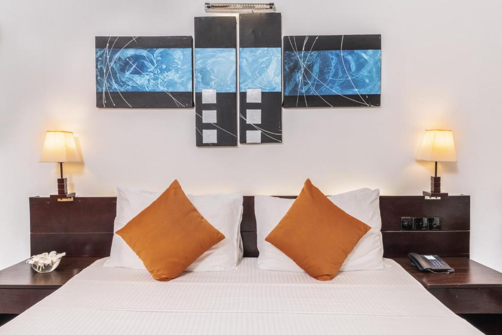 Postel nebo postele na pokoji v ubytování Amethyst Resort Passikudah