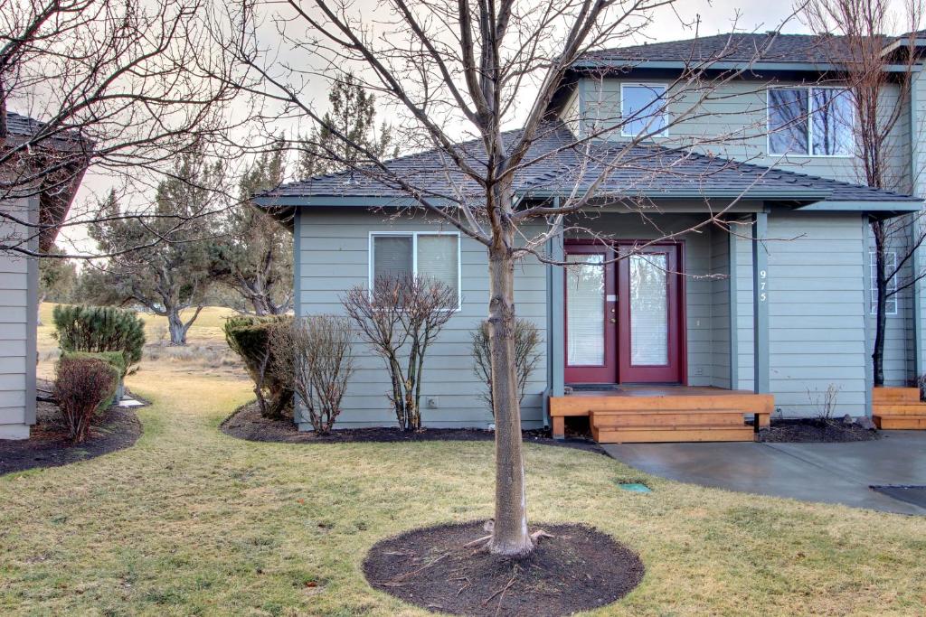 a small house with a tree in front of it at Eagle Crest Resort on Golf Course with Hot Tub in Redmond