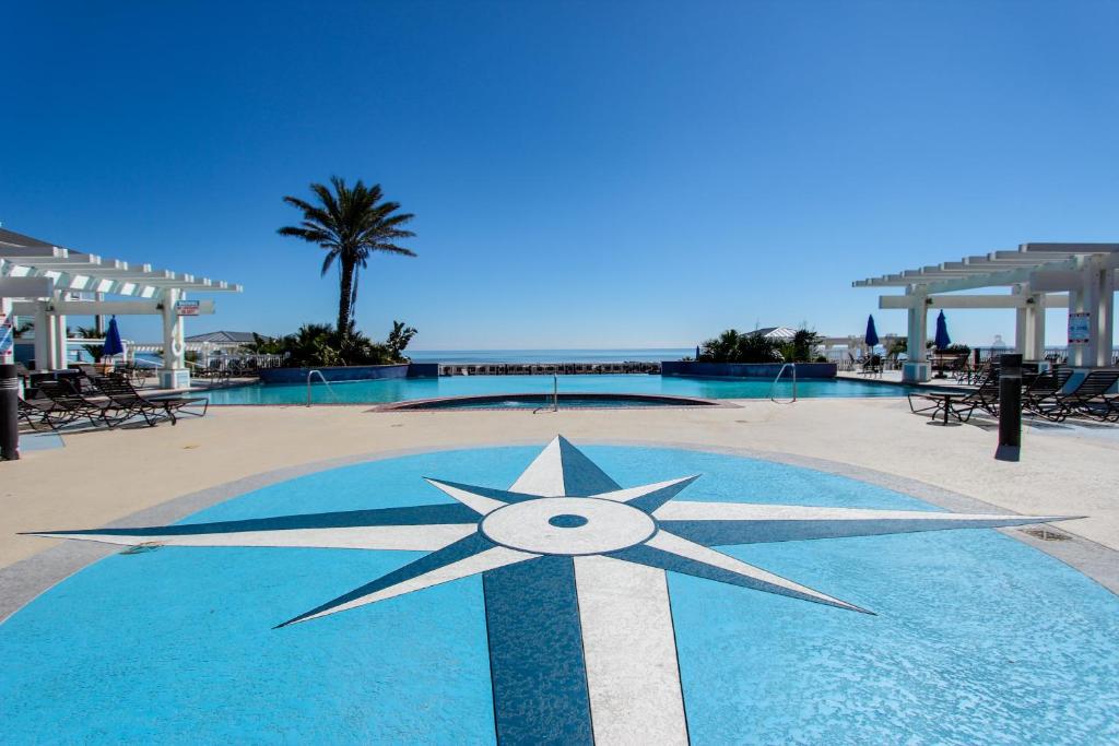 a star on top of a swimming pool at Suits Us in Galveston