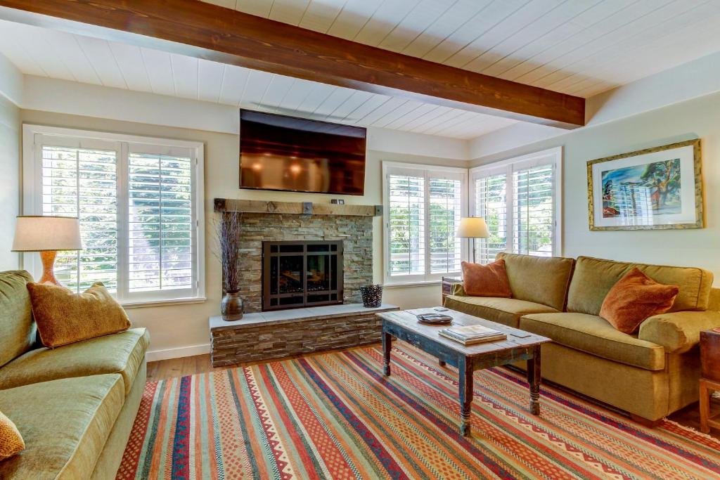 a living room with a couch and a fireplace at Dollar Meadows 1372 in Sun Valley