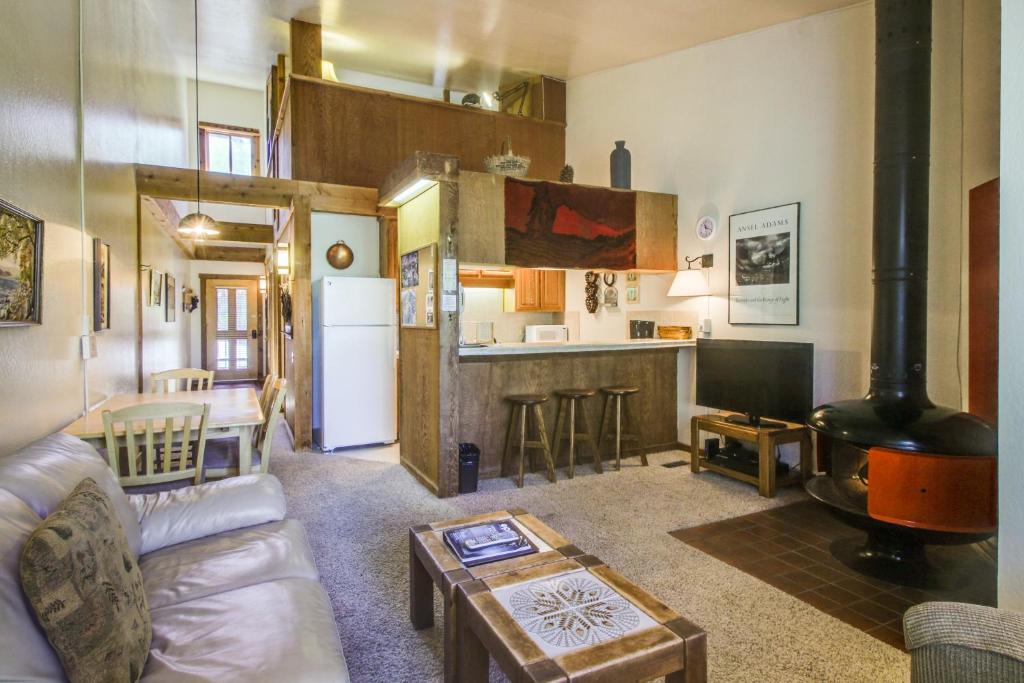 a living room with a couch and a stove at Northstar Ski Trails in Truckee