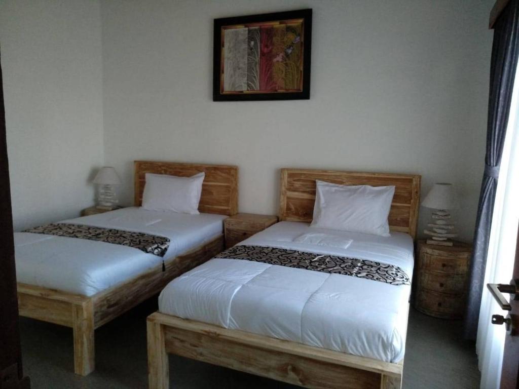Postel nebo postele na pokoji v ubytování TiTi Villa