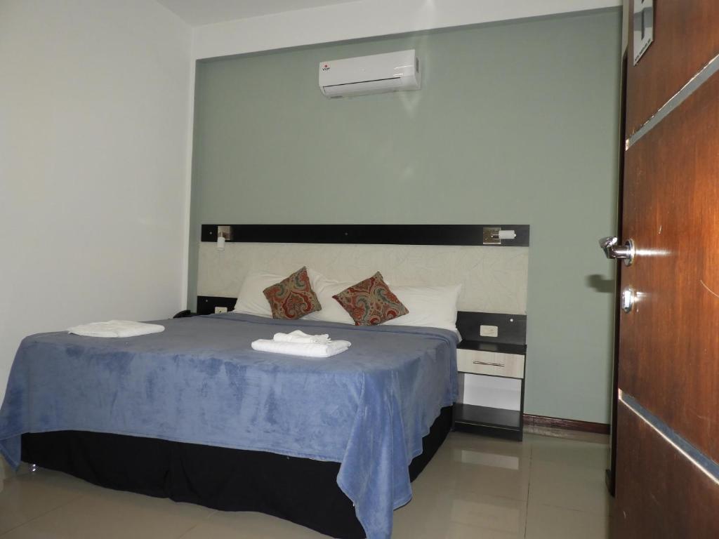 Postel nebo postele na pokoji v ubytování Hotel Puesta del Sol by Nobile