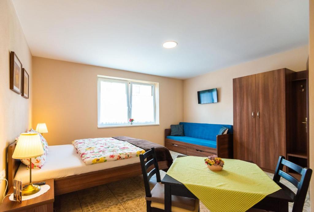 Postel nebo postele na pokoji v ubytování Villa Ephélia