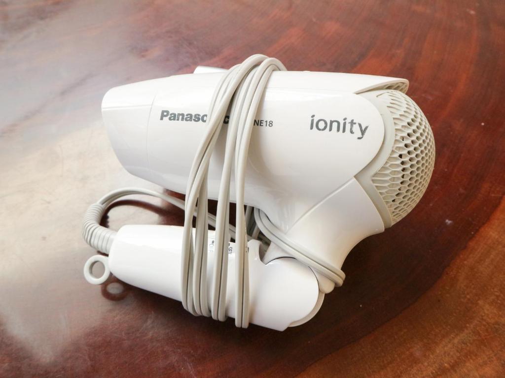 a hair dryer sitting on top of a table at Guest House Minato in Miyako