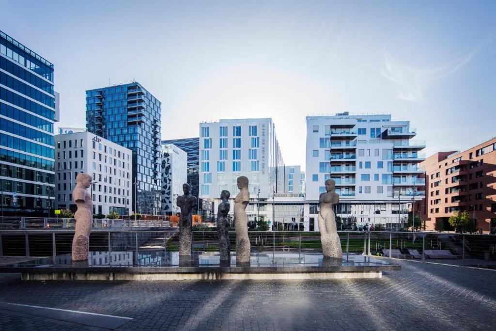 a group of statues in the middle of a city at Clarion Hotel Oslo in Oslo