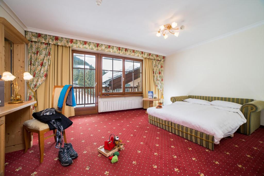 Postel nebo postele na pokoji v ubytování TH Corvara - Greif Hotel