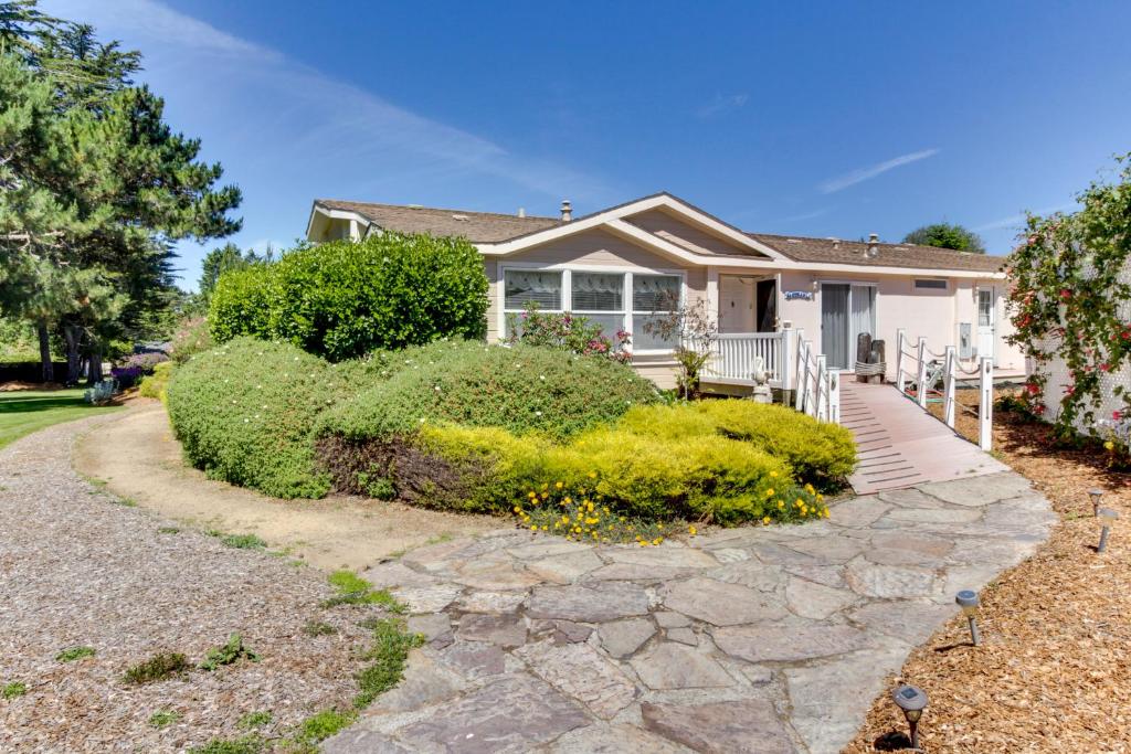 a house with a stone walkway in front of it at Mendocino Dunes - Sandrahla in Fort Bragg