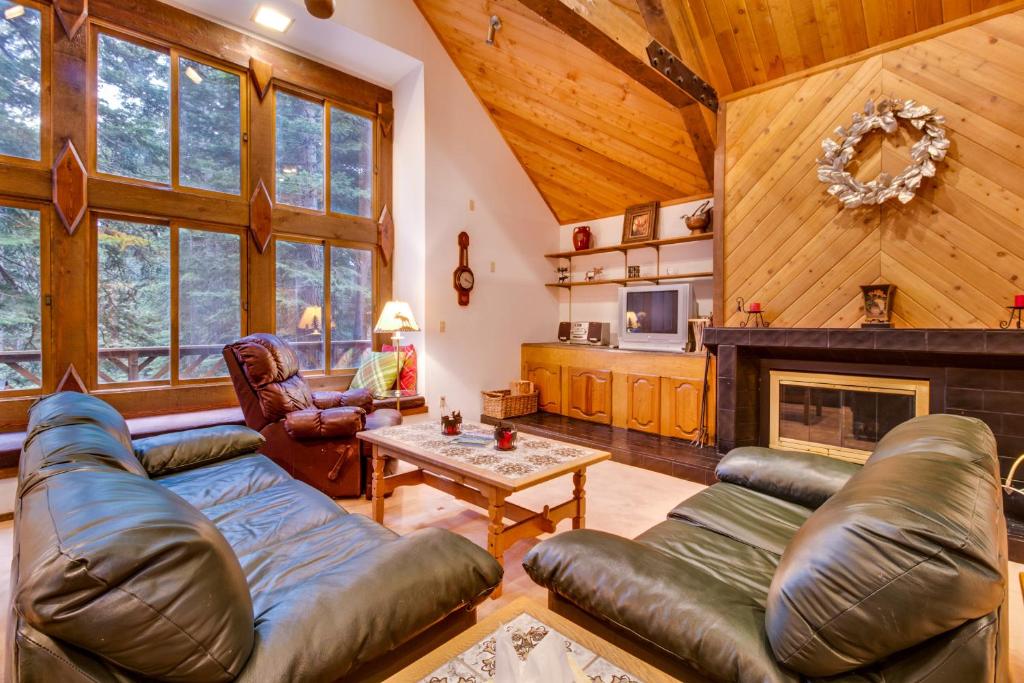 a living room with a couch and a fireplace at Serenity at Tahoe Donner in Truckee