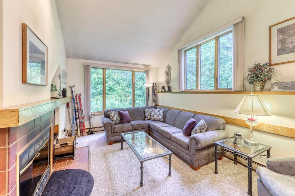 a living room with a couch and a fireplace at The Woods: Townhouse-F3 in Killington