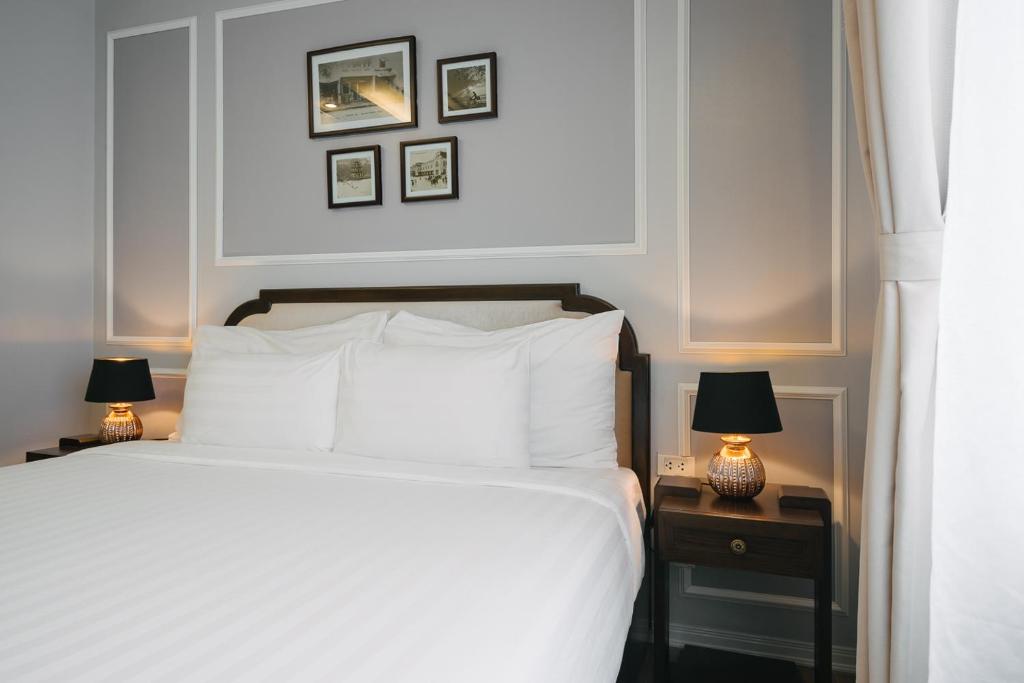 Postel nebo postele na pokoji v ubytování La Palm Hotel