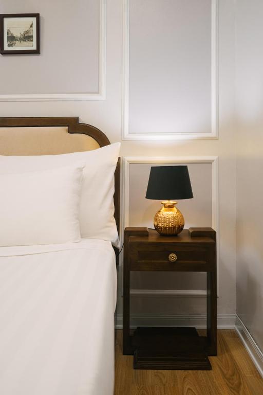 Postel nebo postele na pokoji v ubytování La Palm Hotel