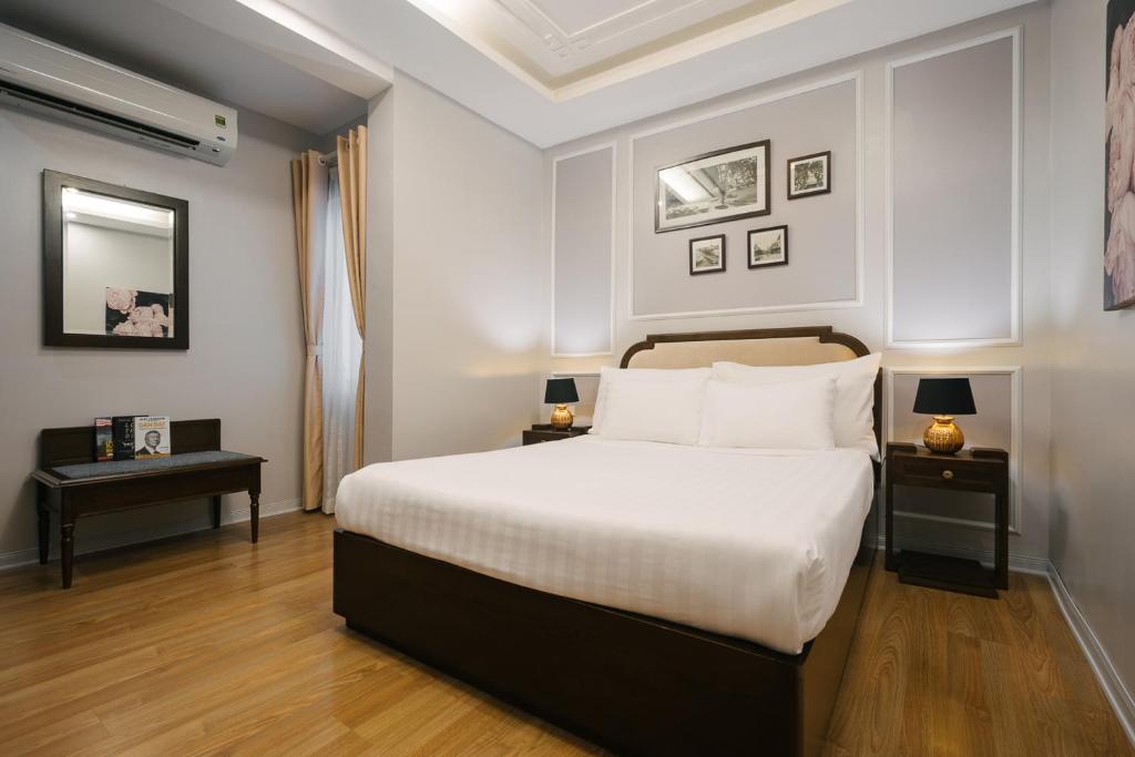 Postel nebo postele na pokoji v ubytování La Palm Hotel