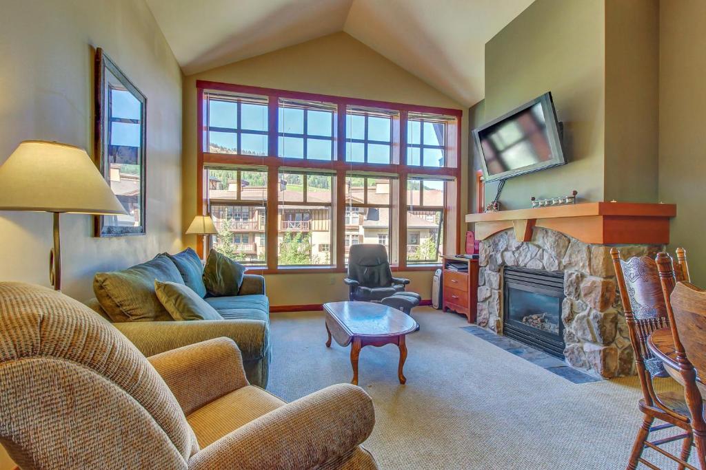 a living room with a couch and a fireplace at Eagle Springs East 315: Osprey Suite in Solitude