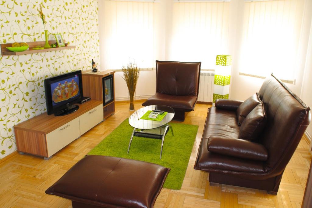 TV a/nebo společenská místnost v ubytování Vila DeLux