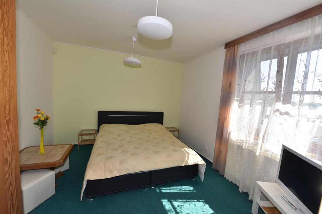 Postel nebo postele na pokoji v ubytování Hotel Trilobit