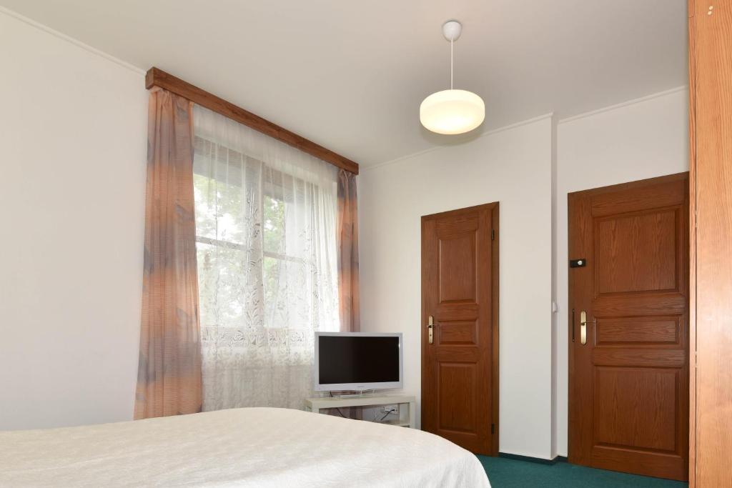 TV a/nebo společenská místnost v ubytování Hotel Trilobit