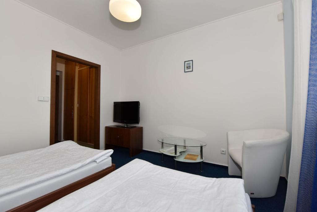 Postel nebo postele na pokoji v ubytování Hotel Trilobit