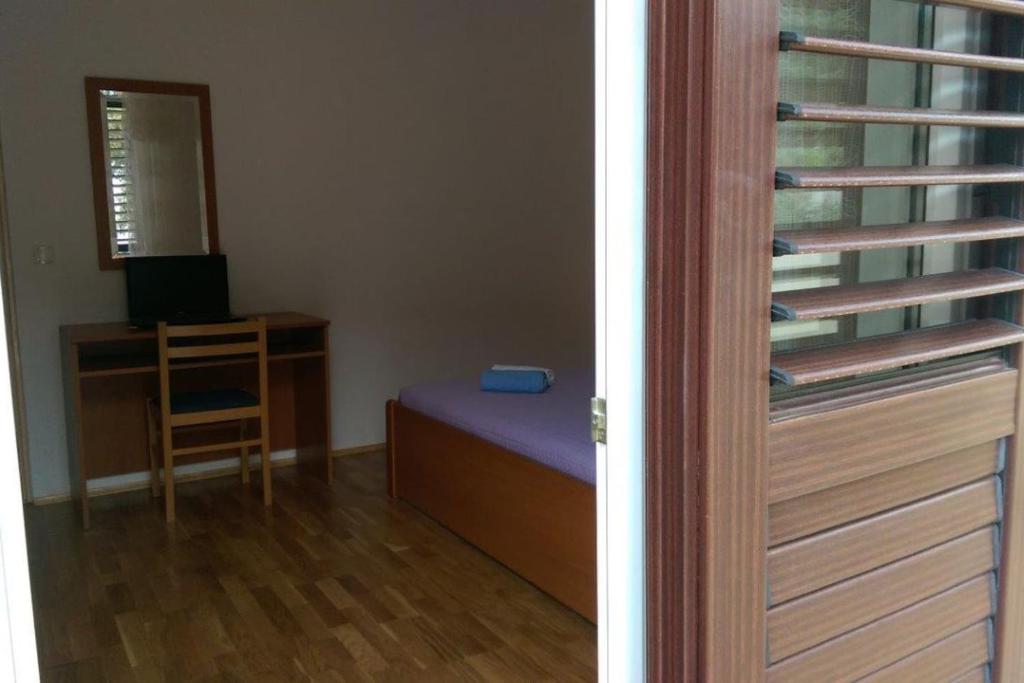 Postel nebo postele na pokoji v ubytování Apartmani Marija
