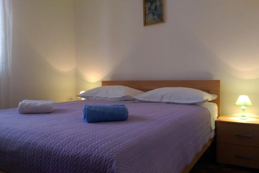 Postel nebo postele na pokoji v ubytování Apartmani Marija