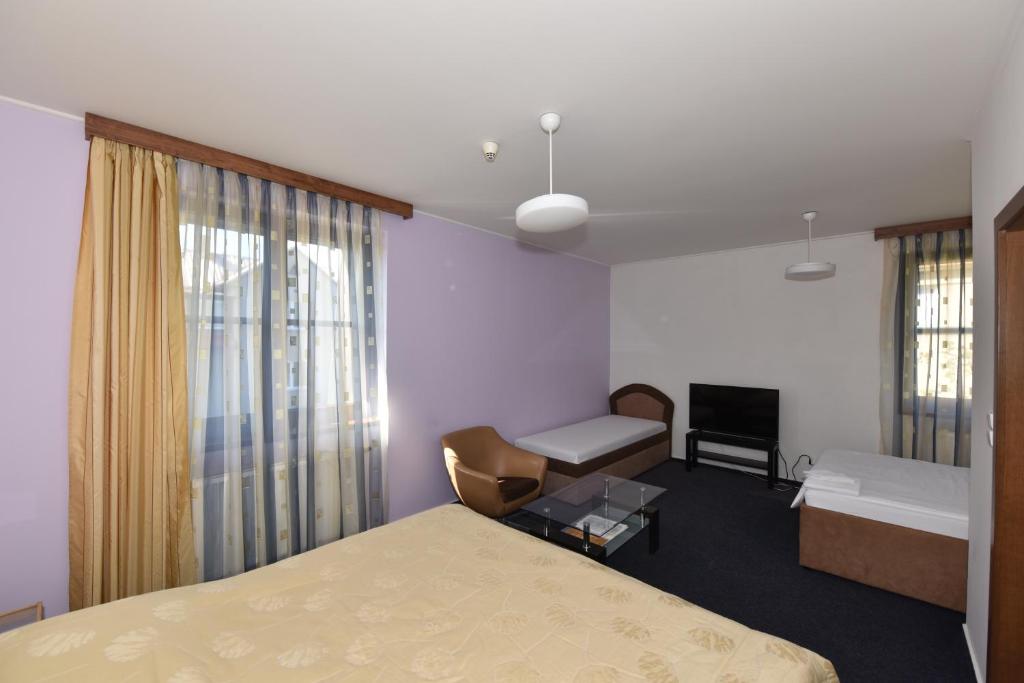 Postel nebo postele na pokoji v ubytování Hotel Trilobit
