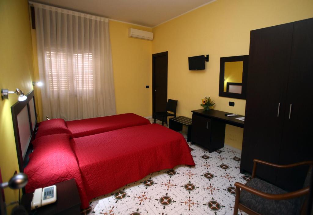 Letto o letti in una camera di Hotel del Sole