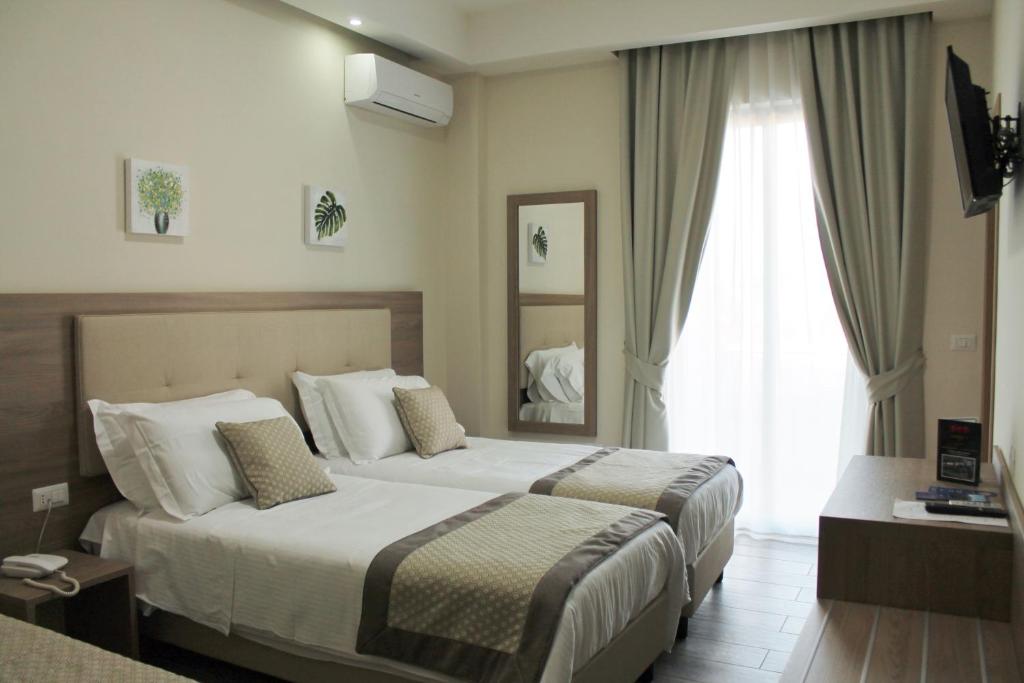 Letto o letti in una camera di Hotel del Sole