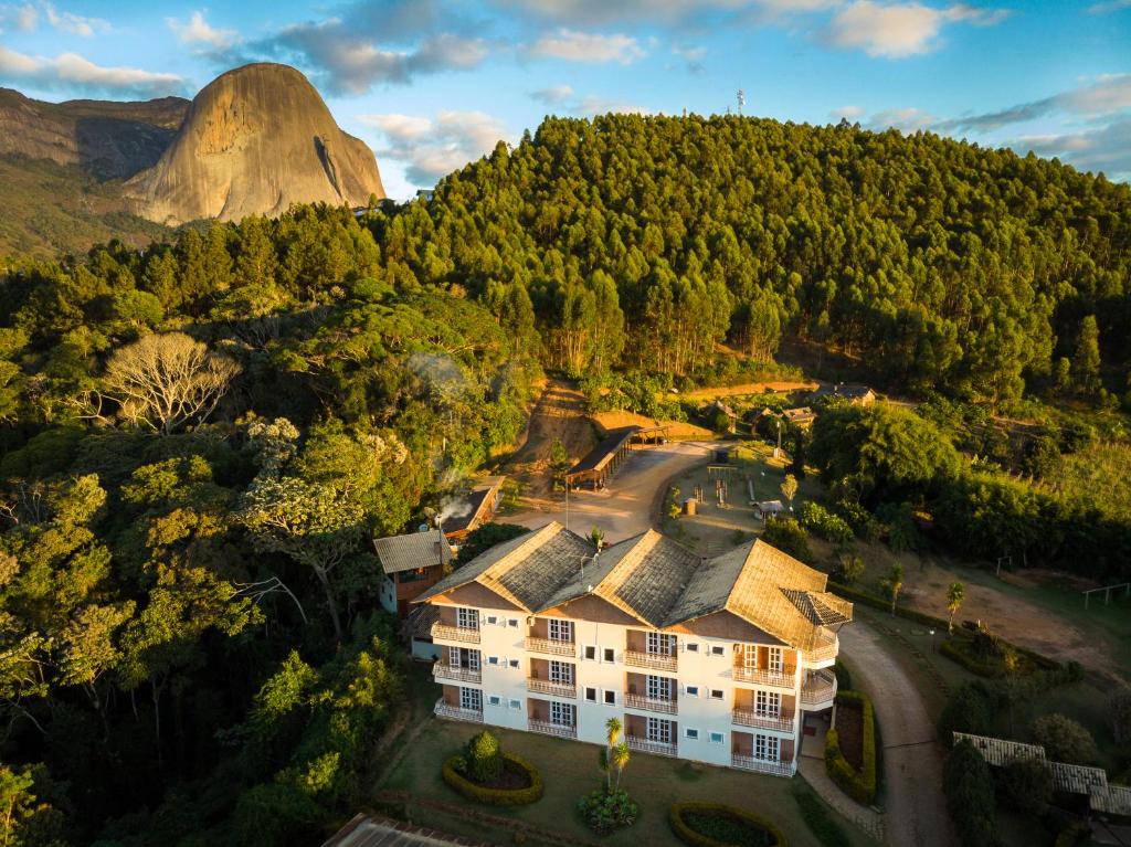 an aerial view of a resort with a mountain in the background at Pousada Lusitânia in Pedra Azul