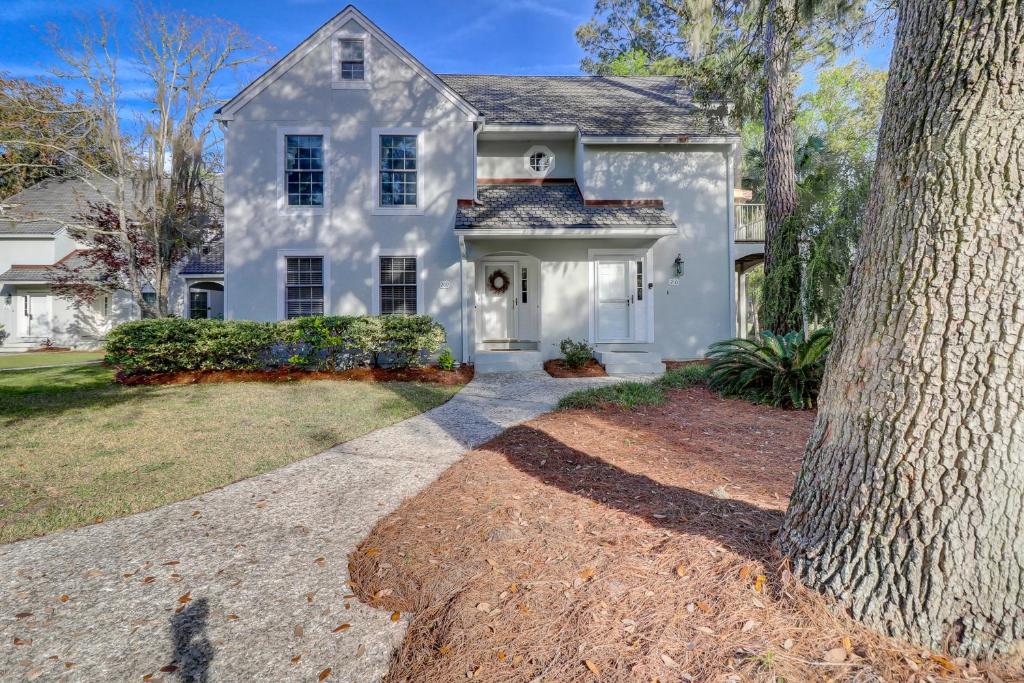 a white house with a tree in front of it at 2 Bed 2 Bath Villa in Island,Shipyard - Hilton Head in Hilton Head Island