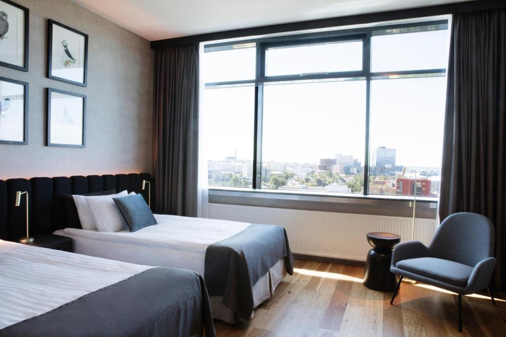 Postel nebo postele na pokoji v ubytování Hotel Reykjavík Grand